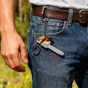 Chainsaw Keychain Portable Chainsaw Key Ring 8 Mini chainsaw keychain hanging from jeans in an outdoor setting!