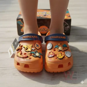 Charizard Pokemon Crocs Clogs with Charms 4 Orange Charizard themed clogs with assorted fire and character charms worn on feet with the box visible behind!