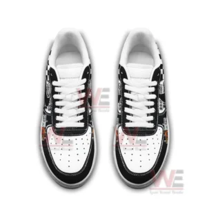 Top view of two black and white graphic sneakers with white laces and perforated toe boxes arranged side by side on a white background.
