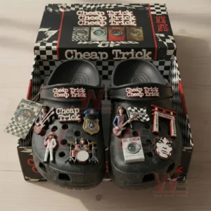Black clogs inside a themed box with rock band charms guitars drums badges and album style decorations!