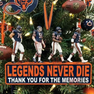 Four football legends in navy uniforms standing on a base with a thank you message hanging on a decorated Christmas tree!
