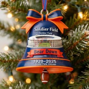 A Christmas ornament shaped like a bell with Soldier Field artwork a large bow and a small football dangling beneath marking the years nineteen twenty to twenty twenty five!
