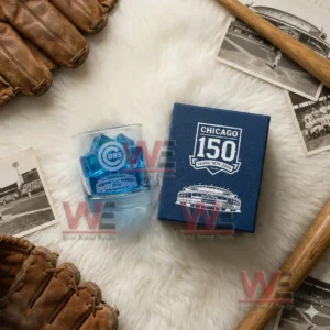 Chicago Cubs 150th Anniversary 1876-2026 Whiskey Glass 5 A Chicago Cubs one hundred fifty year anniversary glass with blue ice next to a blue box among vintage baseball memorabilia!