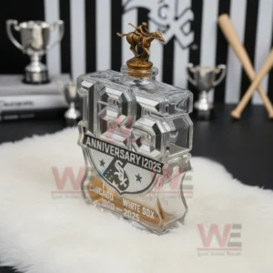 Anniversary bottle with sculpted numbers and rider statue cap highlighting Chicago White Sox branding in a baseball themed setting.