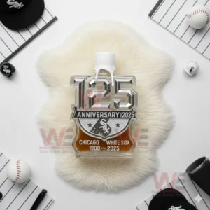 Top view of anniversary bottle with sculpted numbers on white fur surrounded by white and black baseball items.