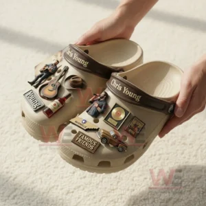 Hands holding beige clogs decorated with Chris Young music themed charms shown from a top angle!
