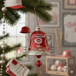 A red and silver Cincinnati Reds bell ornament with baseball stitching hanging on a Christmas tree!
