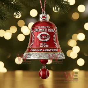 A close up of a red Cincinnati Reds holiday bell ornament with silver detailing and a hanging baseball charm!