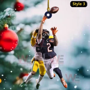 Football action ornament with two players jumping for the ball hanging on a festive snowy Christmas background!