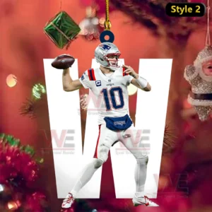 Patriots quarterback wearing number ten is posed to throw a football as a hanging holiday ornament with Christmas decorations behind.