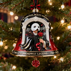 A bell ornament displaying a masked figure in a dark cloak holding a red rose with musical notes and ornate columns in the background!