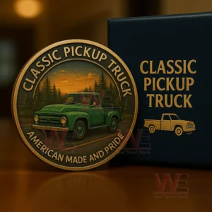 A round coin depicting a green classic pickup truck on a forest road with an orange sunset behind the trees!