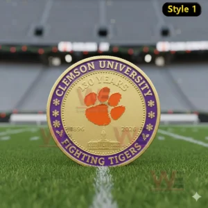 Clemson University commemorative coin with orange paw emblem and purple gold design displayed on a football field!