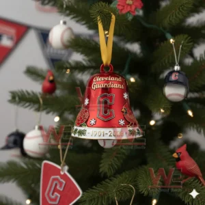 A red and gold Cleveland Guardians holiday bell ornament with winter and floral accents hanging on a Christmas tree!