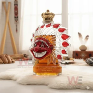 Cleveland Indians chief head shaped decorative bottle on white fur in a bright indoor setting!