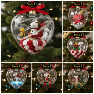 Multiple heart shaped ornaments each displaying Snoopy in different festive Christmas scenes arranged together on a Christmas tree!