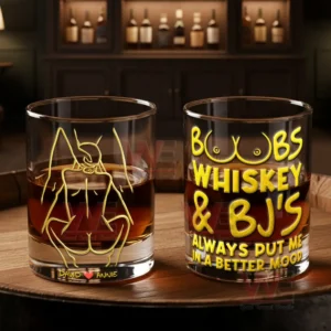 Two engraved whiskey glasses on a wooden tray with romantic couple art and bold text in a warm bar environment!