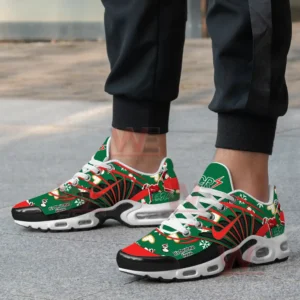 Green red and white Christmas CR7 shoes with holiday graphics worn by a person on pavement!