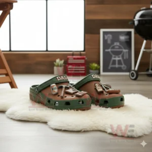Dad themed clogs with grilling and tool charms in a wooden room with a grill.