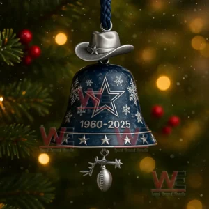 A close up of a Dallas Cowboys bell ornament with star and snowflake motifs and a football charm beneath it!