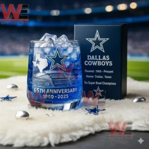 Dallas Cowboys 65th Anniversary 196-2025 Whiskey Glass 7 A blue Dallas Cowboys anniversary glass with ice beside a team box surrounded by small star and football decorations!