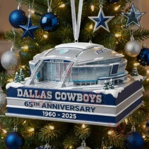 A close view of a Dallas Cowboys themed stadium ornament featuring the iconic arena surrounded by winter details on a holiday tree!