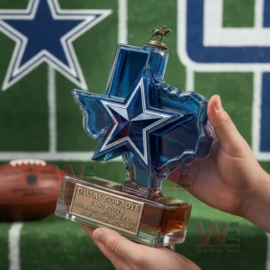 Star shaped commemorative whiskey bottle held against a football field backdrop!