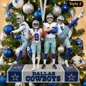 Dallas Cowboys Player Action Pose Ornament 6 A set of small player ornaments in blue and white uniforms positioned on a stand placed in front of a decorated holiday tree!