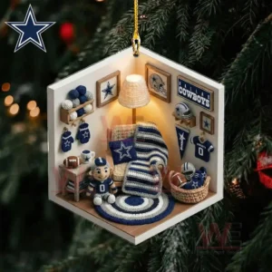 A tiny room shaped ornament featuring crochet furnishings sports themed items and warm lighting hanging on a Christmas tree!