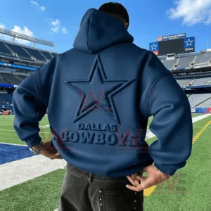 Back view of a blue Dallas Cowboys hoodie with an embossed star logo worn inside a large football stadium!