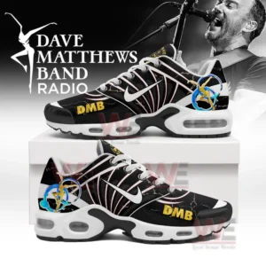 Black and white DMB themed shoes with yellow lettering and band emblems displayed on a box before a singer image!