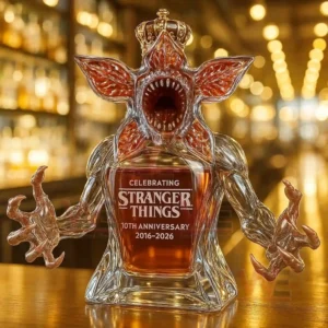 Demogorgon Stranger Things 10th Anniversary 2016-2026 Whiskey Bottle 7 A crowned creature shaped bottle displayed on a bar counter!