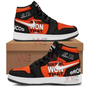 Pair of black and orange high top sneakers shown on a shoebox with white swoosh style mark bold Been There Won That text AFC West Champions details and Broncos lettering on the side panels.