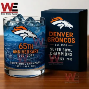Denver Broncos commemorative whiskey glass with ice and detailed blue design placed next to a branded gift box on a wooden surface!