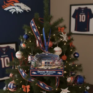 Denver Broncos stadium anniversary ornament displayed on a Christmas tree in a room decorated with Broncos memorabilia!