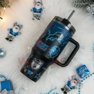 Detroit Lions themed black tumbler with handle and straw resting on a white decorative background with holiday accents!