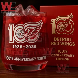 Detroit Red Wings anniversary whiskey glass with red drink ice and branded box on a wooden surface!