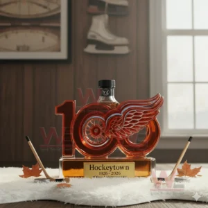 Detroit Red Wings 100th Anniversary Whiskey Bottle 9 Detroit Red Wings inspired whiskey bottle placed on white fur with wooden walls and hockey gear in the background!