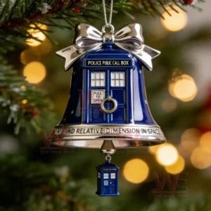 A blue bell ornament shaped like a police call box with a small matching charm hanging beneath it on a Christmas tree branch!