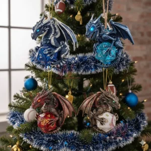 Dragon ornaments holding crystal dice hanging on a decorated Christmas tree.