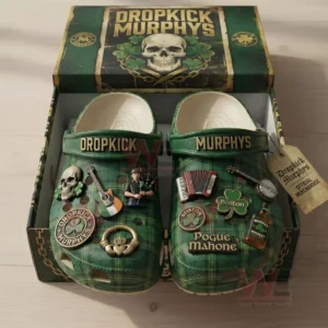 Green plaid clogs in an open dropkick murphys themed box with gold strap text and multiple Irish music charms.