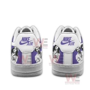 Back view of two purple and white sneakers with purple Nike Air heel tabs and black and white band photo graphics on a white background.
