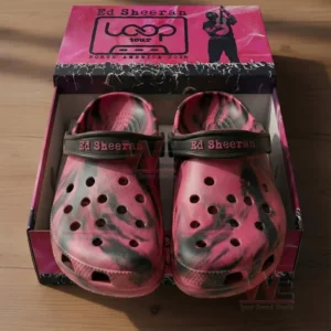 Open shoebox showing pink and black marbled Ed Sheeran themed clogs with black heel straps and a pink branded lid that reads Ed Sheeran Loop Tour North America 2026.