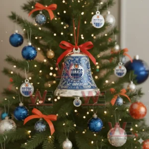Edmonton Oilers anniversary bell ornament hanging on a Christmas tree decorated with blue silver and white ornaments!