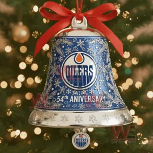 Close up of Edmonton Oilers 54th anniversary blue bell ornament with snowflake patterns and red bow in front of Christmas lights!
