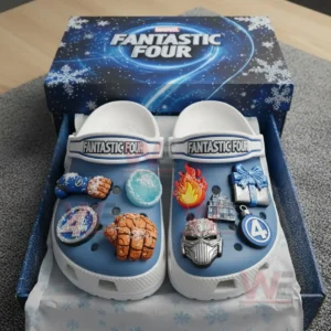 Blue and white clogs with superhero themed charms displayed inside a festive box!