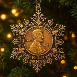 A close view of a gold memorial coin ornament displayed on a Christmas tree with glowing lights in the background!