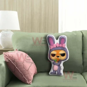 Cartoon rabbit shaped pillow displayed on a green sofa in a cozy living room!