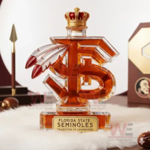 A decorative F S shaped bottle placed on a fluffy rug with Seminoles themed objects behind it!