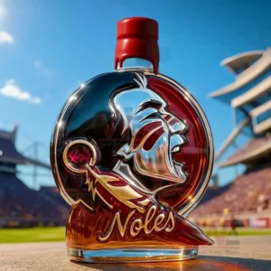 Florida State Seminoles Crown Royal Whiskey Bottle 5 Stylized glass whiskey bottle with face silhouette red cap amber liquid and football stadium scene in sunlight!